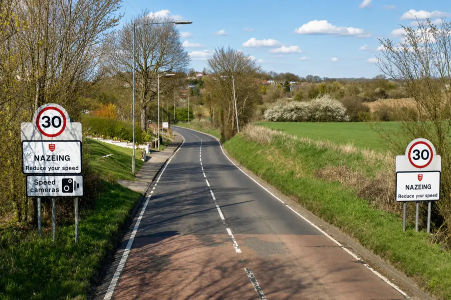 Actual image showing one of the entrances to Nazeing. It shows a road sign at Nazeing in Hertfordshire